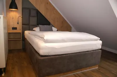 Ein Bett oder Betten in einem Zimmer der Unterkunft Hotel Grüner Baum