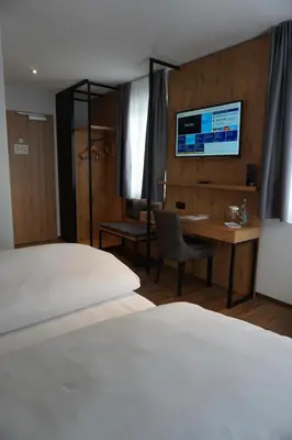 Ein Bett oder Betten in einem Zimmer der Unterkunft Hotel Grüner Baum