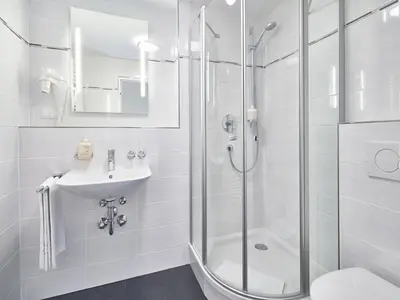 Ein Badezimmer in der Unterkunft Hotel Alfa Zentrum