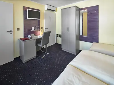 Ein Bett oder Betten in einem Zimmer der Unterkunft Hotel Alfa Zentrum