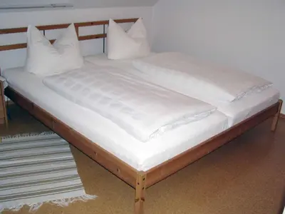 Ein Bett oder Betten in einem Zimmer der Unterkunft Ferienwohnung Hartinger