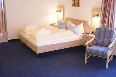 Ein Bett oder Betten in einem Zimmer der Unterkunft Hotel Landhaus Feldmeier ***S