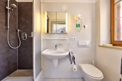 Ein Badezimmer in der Unterkunft Hotel Antonia