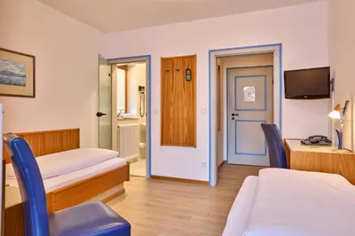 Ein Bett oder Betten in einem Zimmer der Unterkunft Hotel Antonia