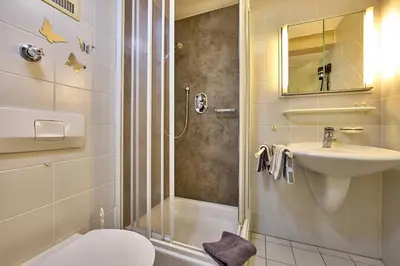 Ein Badezimmer in der Unterkunft Hotel Antonia