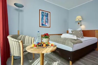 Ein Bett oder Betten in einem Zimmer der Unterkunft Hotel Königshof
