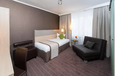 Ein Bett oder Betten in einem Zimmer der Unterkunft Hotel New Orly