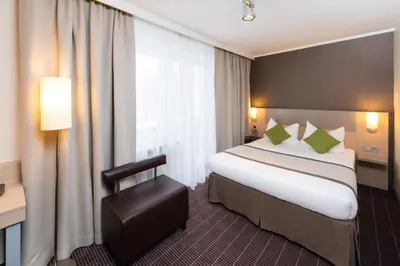 Ein Bett oder Betten in einem Zimmer der Unterkunft Hotel New Orly