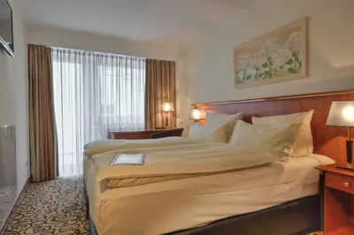 Ein Bett oder Betten in einem Zimmer der Unterkunft Hotel Condor