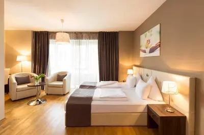 Ein Bett oder Betten in einem Zimmer der Unterkunft Empress Boutique Hotel