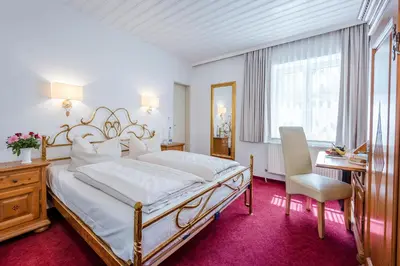 Ein Bett oder Betten in einem Zimmer der Unterkunft Laimer Hof am Schloss Nymphenburg