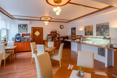 Ein Sitzbereich in der Unterkunft Hotel Astor