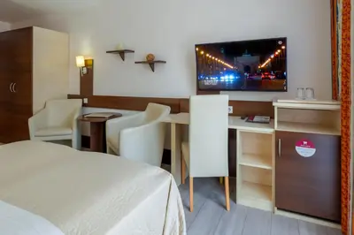 Ein Bett oder Betten in einem Zimmer der Unterkunft Hotel Astor