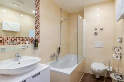 Ein Badezimmer in der Unterkunft Hotel Astor
