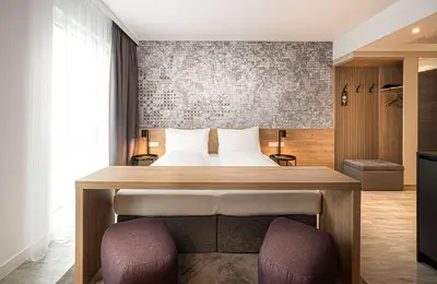 Ein Bett oder Betten in einem Zimmer der Unterkunft elaya hotel augsburg, Trademark by Wyndham