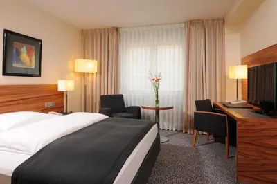 Ein Bett oder Betten in einem Zimmer der Unterkunft Maritim Hotel München