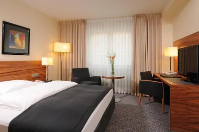 Ein Bett oder Betten in einem Zimmer der Unterkunft Maritim Hotel München