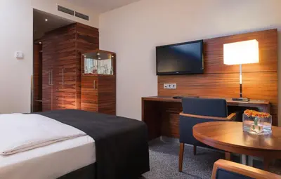 Ein Bett oder Betten in einem Zimmer der Unterkunft Maritim Hotel München