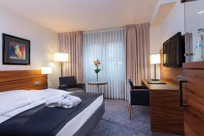 Ein Bett oder Betten in einem Zimmer der Unterkunft Maritim Hotel München