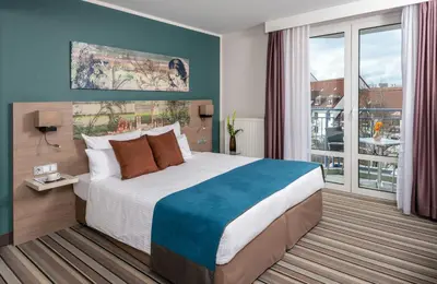 Ein Bett oder Betten in einem Zimmer der Unterkunft Leonardo Hotel Munich City Olympiapark