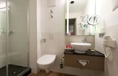 Ein Badezimmer in der Unterkunft Leonardo Hotel Munich City Olympiapark