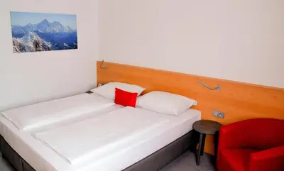Ein Bett oder Betten in einem Zimmer der Unterkunft Sure Hotel by Best Western Muenchen Hauptbahnhof