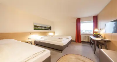 Ein Bett oder Betten in einem Zimmer der Unterkunft Sure Hotel by Best Western Muenchen Hauptbahnhof