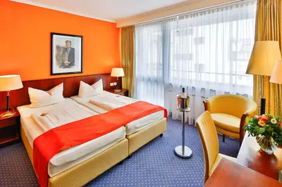 Ein Bett oder Betten in einem Zimmer der Unterkunft Superior Hotel Präsident
