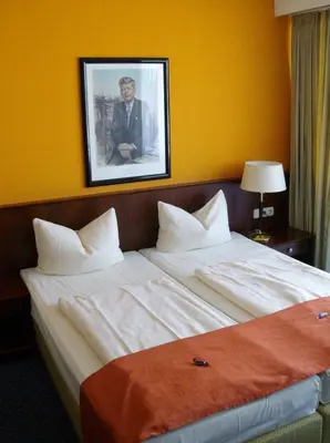 Ein Bett oder Betten in einem Zimmer der Unterkunft Superior Hotel Präsident