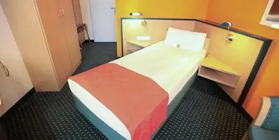 Ein Bett oder Betten in einem Zimmer der Unterkunft Superior Hotel Präsident