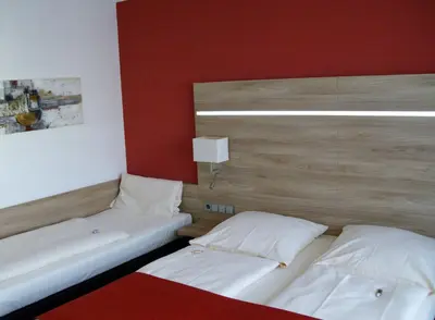 Ein Bett oder Betten in einem Zimmer der Unterkunft Superior Hotel Präsident