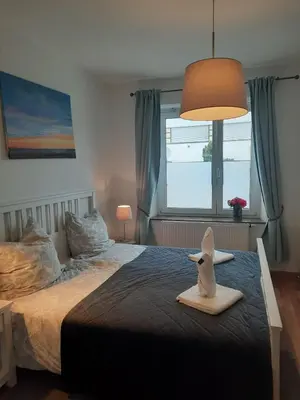 Ein Bett oder Betten in einem Zimmer der Unterkunft Gemütliche Wohnung zentral Augsburg