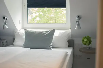 Ein Bett oder Betten in einem Zimmer der Unterkunft Hotel Wetterstein