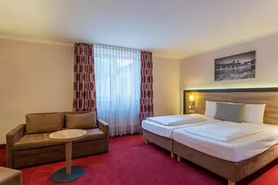 Ein Bett oder Betten in einem Zimmer der Unterkunft Hotel Wetterstein
