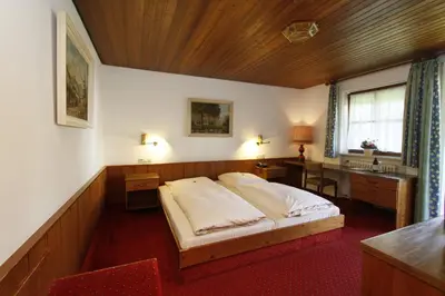 Ein Bett oder Betten in einem Zimmer der Unterkunft Hotel Neumayr