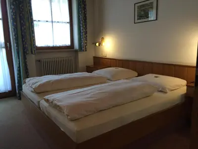 Ein Bett oder Betten in einem Zimmer der Unterkunft Hotel Neumayr