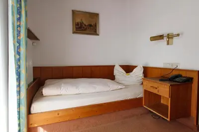 Ein Bett oder Betten in einem Zimmer der Unterkunft Hotel Neumayr