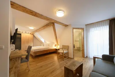 Ein Bett oder Betten in einem Zimmer der Unterkunft Hotel garni Alpengruss