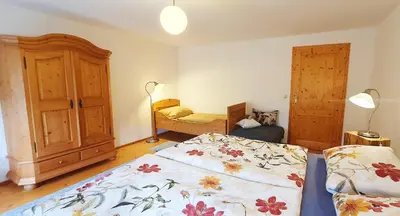 Ein Bett oder Betten in einem Zimmer der Unterkunft Stadlerhof