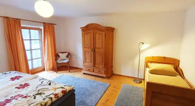 Ein Bett oder Betten in einem Zimmer der Unterkunft Stadlerhof