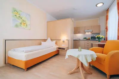 Ein Bett oder Betten in einem Zimmer der Unterkunft Hotel Abenstal