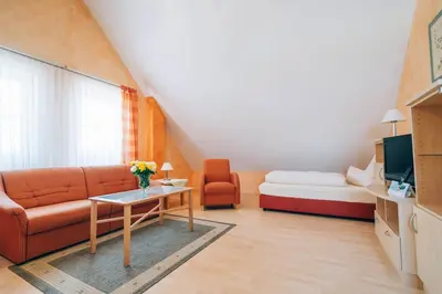 Ein Bett oder Betten in einem Zimmer der Unterkunft Hotel Abenstal