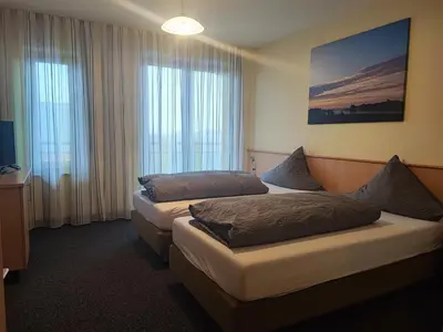 Ein Bett oder Betten in einem Zimmer der Unterkunft Wirtshaus Zur Bina