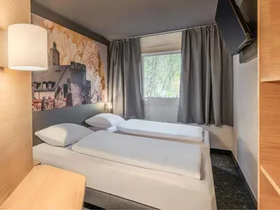 Ein Bett oder Betten in einem Zimmer der Unterkunft B&B HOTEL Ingolstadt-Lenting
