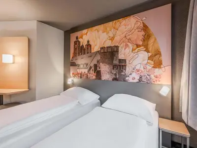 Ein Bett oder Betten in einem Zimmer der Unterkunft B&B HOTEL Ingolstadt-Lenting