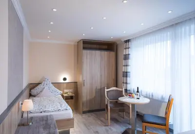 Ein Bett oder Betten in einem Zimmer der Unterkunft Kurhotel Dornröschen