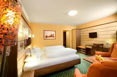 Ein Bett oder Betten in einem Zimmer der Unterkunft Kur- und Wellnesshotel Förch