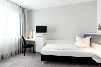 Ein Bett oder Betten in einem Zimmer der Unterkunft Altstadthotel