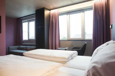 Ein Bett oder Betten in einem Zimmer der Unterkunft Roomreich