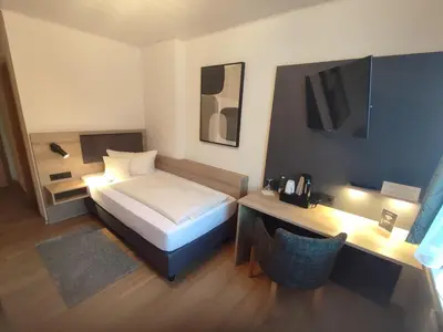 Ein Bett oder Betten in einem Zimmer der Unterkunft Hotel Landgasthof Euringer